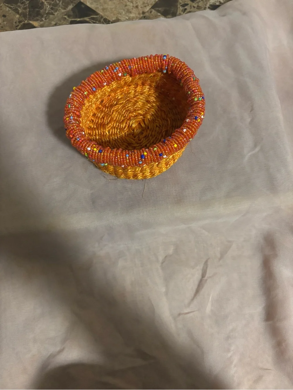 Handwoven Orange Jewelry Basket with Beaded Accent